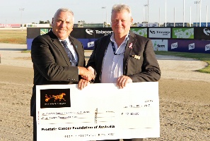 PCFA board member Geoff Underwood accepts the cheque from Peter Watkinson.