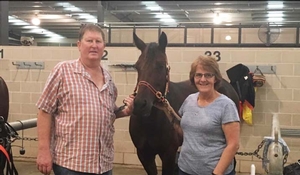 Garry and Michelle Armstrong with their pacer Overtaking Lane following her win at Menangle last year.