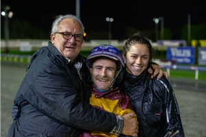 An emotional Daryl Miller with son, reinsman Mitchell Miller, and Deni Robers after his first metropolitan winner.