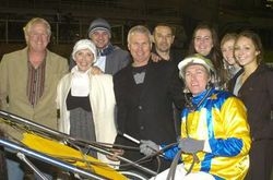 The delighted connections of Im Themightyquinn surround trainer Gary Hall Snr and driver Gary Hall Jnr