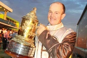 Gold; Mark Purdon with one of several trophies won by his champion trotter I Can Doosit throughout the 2011/12 Grand Circuit season.
