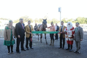 Official presentation to race winner, Dreamtime Sara, trained by Kerry Ann Turner (fourth from right), and driven by Robert Morris (fourth from left), at Bankstown Paceway, on Christmas in July Race Day, July 27th, 2012.