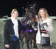 Amanda Grieve (left) pictured after winning a Tabcorp Park race with Baby Bling. 