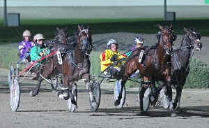 Kept Under Wraps (outside) grabs Bidy Mach to win the Tatlow Stakes at Tabcorp Park Melton. 