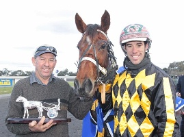 Illawong Helios with trainer Ross Sugars and driver Greg Sugars at Maryborough. 