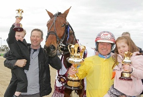 Winning trainer David Aiken and driver Chris Alford with Spidergirl and Alford's children. 