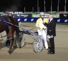 Josh Aiken speaks with MC Rob Auber after winning the Italian Cup aboard Cold Major. 