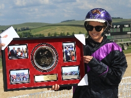 Jess Prior accepting the JC Caffyn Plate from race sponsor Michael Brown
