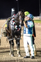 DAVID MORAN gives Lochinvar Art a loving pat after their Chariots Of Fire win at Club Menangle