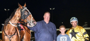 Trainer Aaron Goasby holding Takara Truffle following one of her many wins.