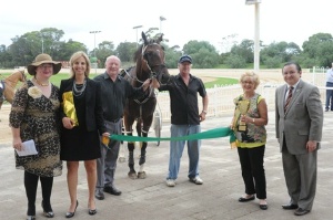 Leading Bankstown Paceway trainer Martin Herbert (third from right) and five year old bay gelding Intrepid Traveller at the presentation of the 2013 Allied Express Lunar New Year Cup at Bankstown Paceway.